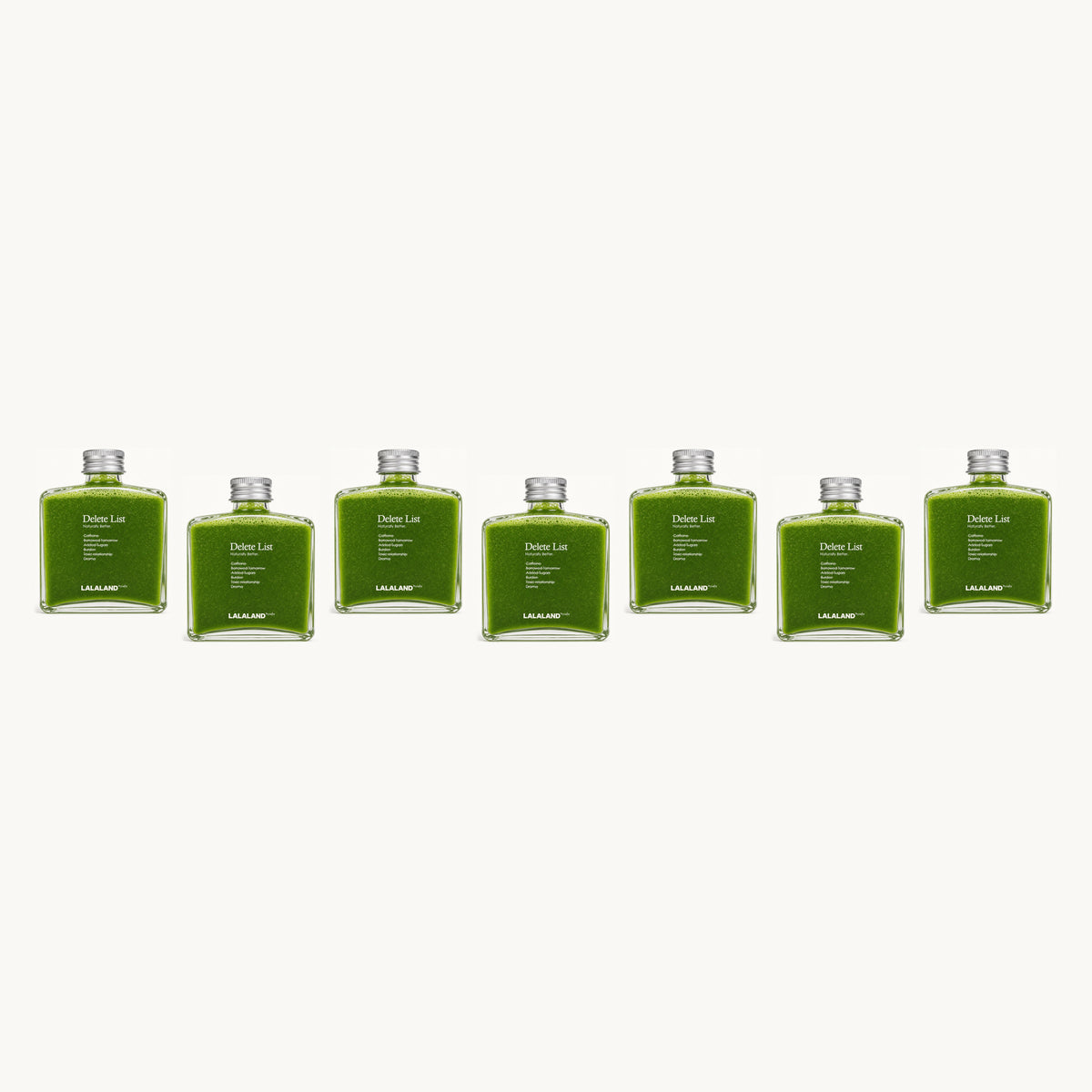 Lalaland® green-team — 7 bottles, single staggered row: green, green, green, green, green, green, green
